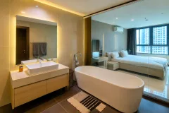 The Point Pratumnak — Condo Near Cozy Beach in Pattaya — bedroom or private area
